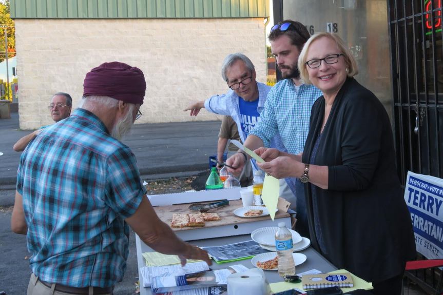 State Rep. Peter Tercyak (26) and State Senator Terry Gerratana (6) serve up pizza registering voters on October 19th. (Gerratana photo)